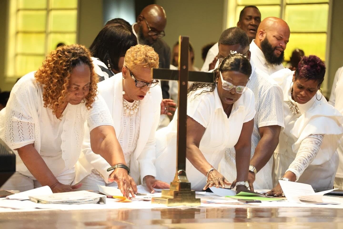 New Hope Cathedral congregation in corporate prayer