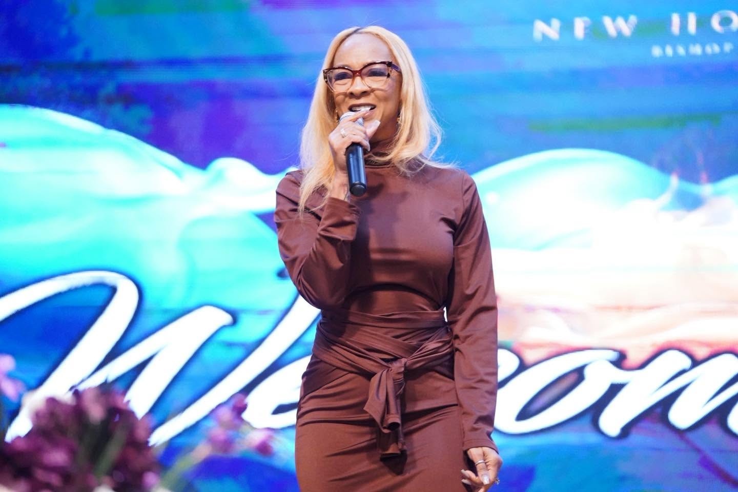 Executive Pastor Synetra Leaphart-Mack ministering on stage at New Hope Cathedral